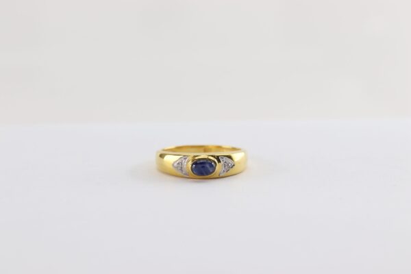 Goldring mit Blautopas und zwei Diamanten